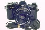 Canon AE-1 35mm Film Manual SLR Camera + 50mm F/1.8 FD Lens in Black - Excellent