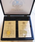 A lovely 'The official Coins of  Russian' collection box c/w 2 x  5 rouble coins