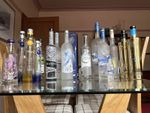 Selection of 15  decorative vodka bottlles with a few rare oness all ( empty)