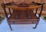 Mahogany Canterbury  Style / Magazine With Four Sections On Brass Castors