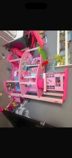barbie bundle for sale includes Barbie dreams house, dolls, accessories, cars