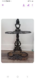 VINTAGE CAST IRON UMBRELLA STAND.