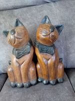Pair of  heavy hand carved wooden character cats 10 inches high