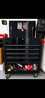 Tool trolley with tools. 6 draws lift up top and power point