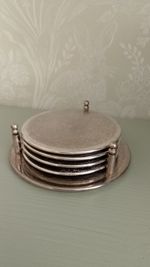 Elegant silver plated drinks coasters set of 4 with holder embossed filigree