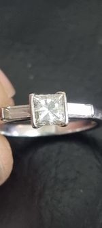 Engagement Ring 18ct white gold. 3 stone princess cut and baguette cut diamond