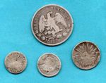 4 OLD MEXICO SILVER COINS 1785 - 1870, IN A WELL USED CONDITION. JOB LOT.