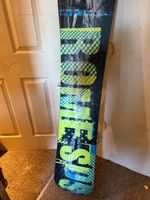 Rome SDS Graft snowboard with Union Force Bindings and Rome Europe carry bag
