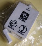 A standard ADSL Modem & Phone Line Splitter (ACC-107-012), Brand New / Unopened.