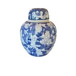 A blue and white Chinese porcelain vase with floral motifs and a seal mark.