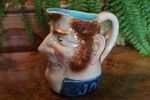 Nineteenth century Large John Bull Majolica Jug with turquoise and rose glazes