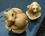 2 Japanese nut carving netsukes with glass eyes both signed to base