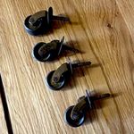 Set of 4 brass Small Black Swivel Caster Wheels, Screw-In Stem Mount