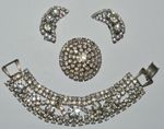 Vintage art deco clear rhinestone bracelet, brooch, and clip earrings, as found