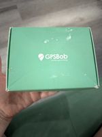 GPSBob brand GPS tracking device, featuring a green box with the company logo.