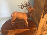 A BEAUTIFUL VINTAGE BROWN LEATHER MAJESTIC STAG  ,WITH GLASS EYES.