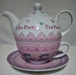 Teapot for one set. teapot, a teacup, and a matching saucer.