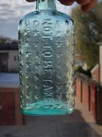 Victorian 1880 poison bottle, embossed with stars and not to be taken