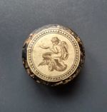 A delightful early 19thC wooden patch box, the lid displaying a print of Pluto.