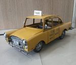 70's style yellow cab vintage metal ornament