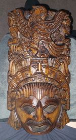 vintage hand-carved wooden Mayan or Aztec style wall mask from Mexico.