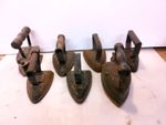 7 ANTIQUE CAST IRON CLOTHES IRONS 1 CHARCOAL IRON 1 ELECTRIC PLUS 5 OTHERS.