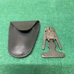 Vintage British Buttner tobacco pipe reamer, a tool designed to clean.