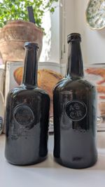 A pair of 18th Century Oxford College cellars wine bottles
