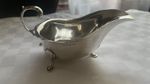 A HM Silver sauce boat weighing 84.3 gm