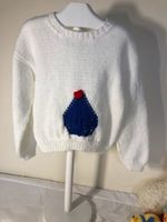 Toddlers white jumper with boat motif in double knit and buttons on back