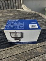 black halogen security floodlight featuring a PIR motion sensor Boxed