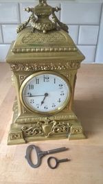 Beautiful ornate brass 8 day clock with 2 keys working nicely decorated solid