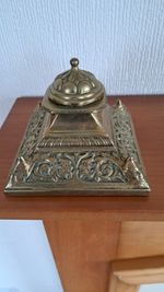 Vintage Brass Inkwell With Incert Well  4" X 3" Depicting Faces On Each Corner