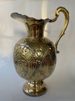 Vintage brass jug with relief decoration of "kissing fish”