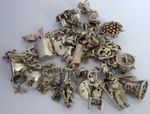 Vintage heavy solid silver charm bracelet &many curious silver charms inc moving
