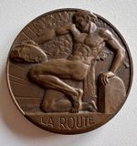 French Art Deco bronze medal, designed by Ray Pelletier, male nude, La Route