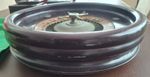 vintage wooden roulette wheel with felt and boxes of chips