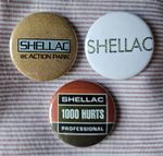 Shellac three 25mm button badges, 'At Action Park' / '1000 Hurts'. Free UK P&P!