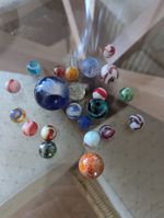 Collection of 22 old vintage colourful marbles all sizes.