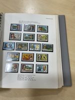Papua New Guinea, Christmas + Cocos Islands stamps. Mint. Pre printed Album @103