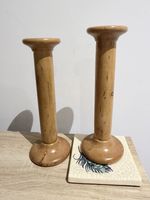 Mid-century wooden candlestick holders simple turned design and natural finish.