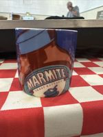 An Official Marmite Merchandise Dark Blue Egg Cup, 50mm Tall, In Good Condition.