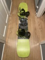 Burton Paramount 162 snowboard with Burton Mission EST bindings.