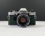 Olympus OM10 35mm SLR Film Camera w Zuiko 50mm 1.8 Lens Green Leathe NEW SEALS