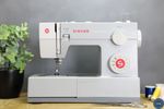 Boxed Singer Heavy Duty 4423 Sewing Machine + 11 Foot & Attachment Set