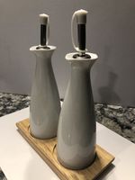 20 Sets Of Oil and Vinegar Set, White Ceramic on a Wooden Plinth SALE PRICE