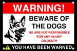 Beware of the dogs! we are not responsible for any injury dog sign