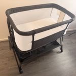Grey & White  Crib with Mesh Sides, Wheels & Storage Basket