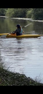 Three Used Kayaks, Green Conquest, Blue Falchion 385 And Yellow Kayak + Paddles