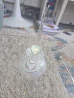 vintage white iridescent swirl glass perfume bottle with a stopper.